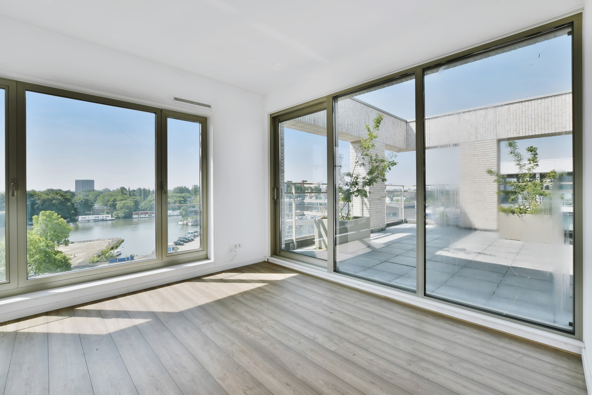 Floor-to-ceiling sliding glass doors in modern apartment