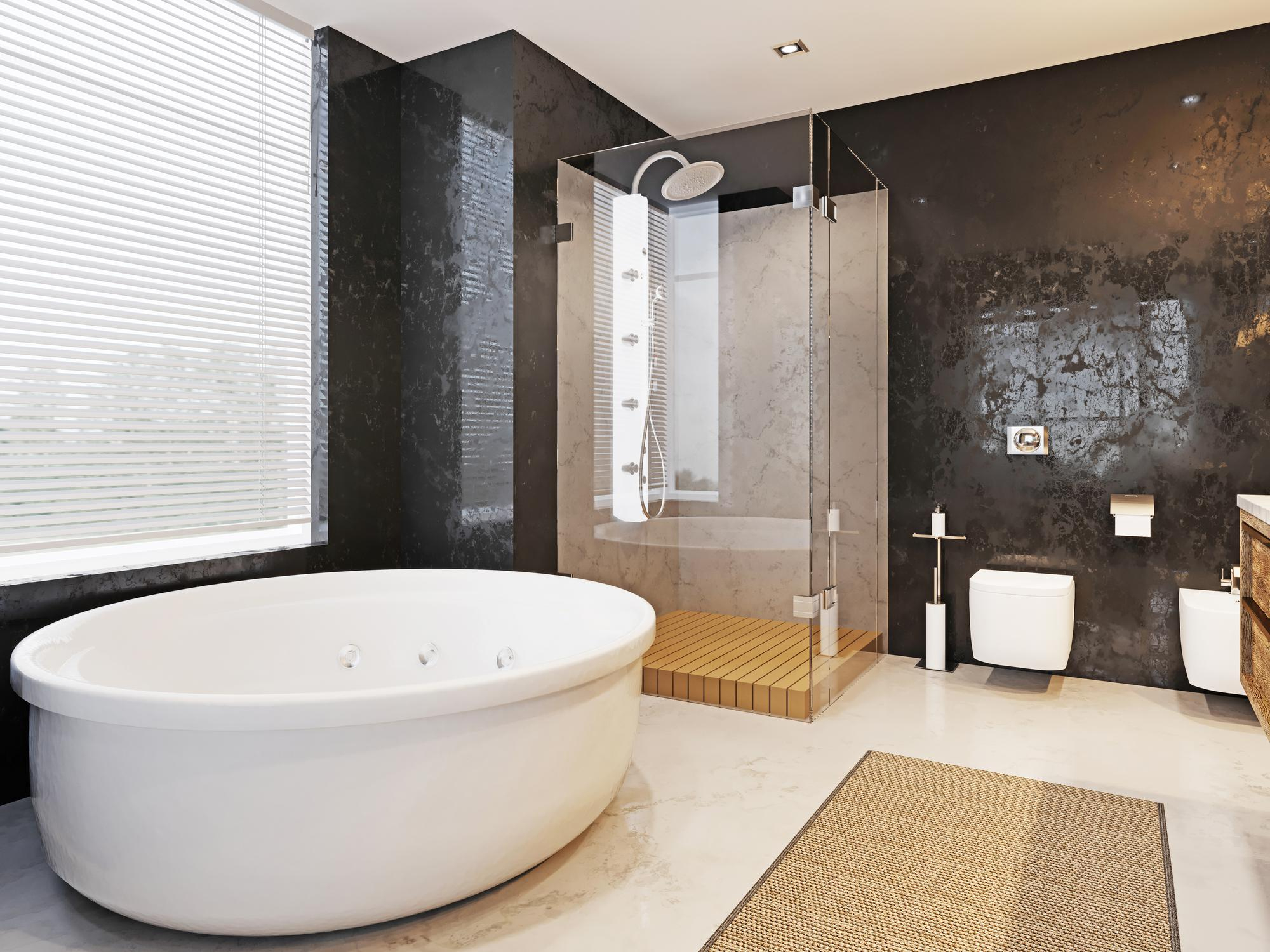 Luxury bathroom featuring frameless glass shower enclosure